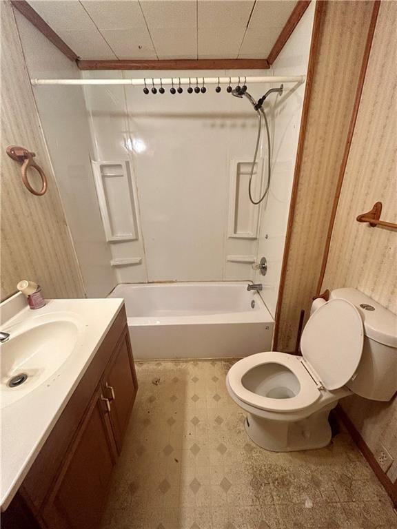 full bath with tile patterned floors, vanity, toilet, and shower / tub combination