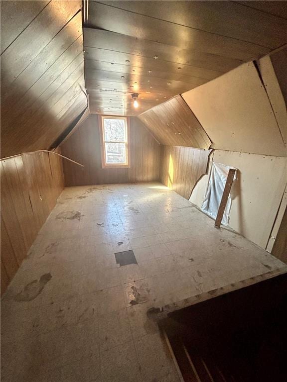 bonus room with wooden ceiling and vaulted ceiling