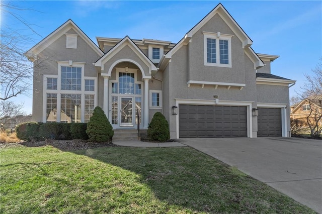 traditional-style house with stucco siding, a front lawn, concrete driveway, and a garage