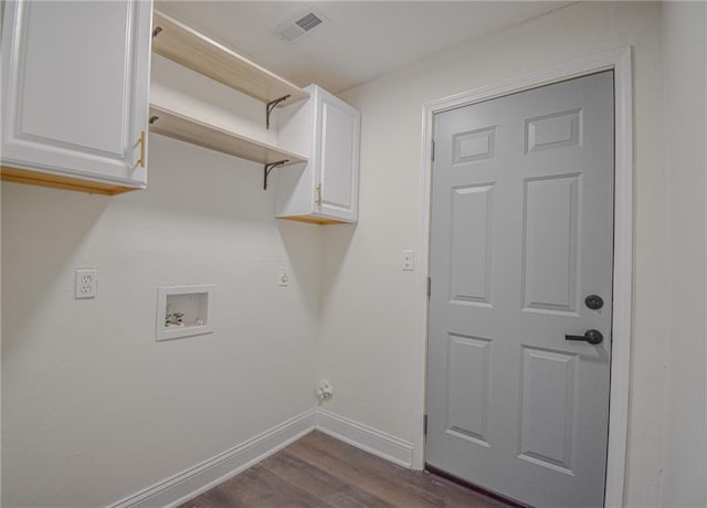 laundry room with visible vents, baseboards, dark wood finished floors, cabinet space, and washer hookup