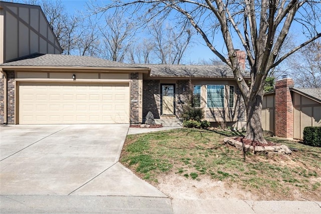 view of front facade with brick siding, an attached garage, and concrete driveway