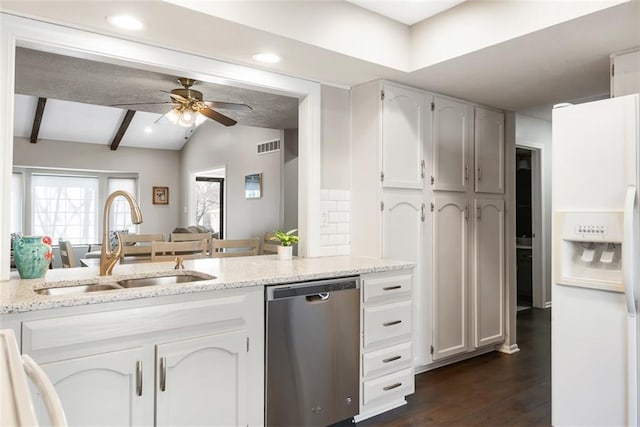 kitchen with lofted ceiling with beams, a sink, dark wood-type flooring, white fridge with ice dispenser, and stainless steel dishwasher