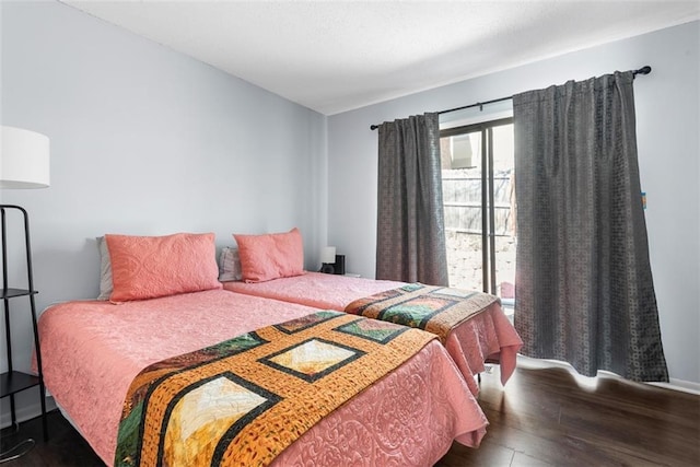 bedroom with wood finished floors