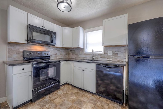 kitchen featuring black appliances, a sink, tasteful backsplash, a textured ceiling, and white cabinetry