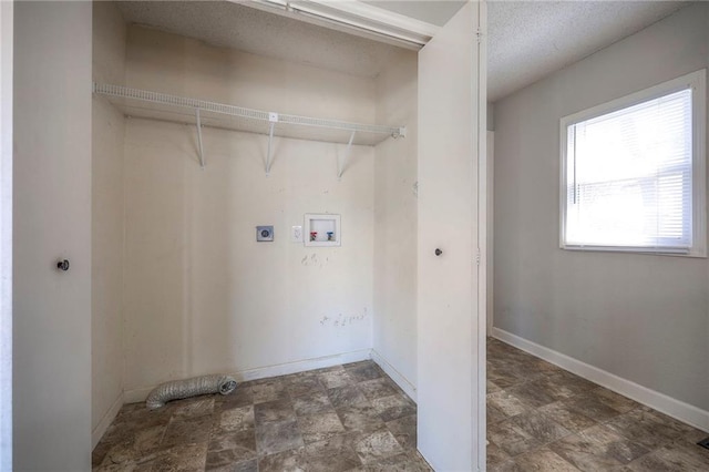 washroom featuring electric dryer hookup, baseboards, hookup for a washing machine, and laundry area