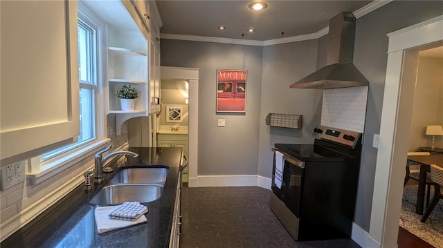 kitchen with stainless steel electric range oven, baseboards, ornamental molding, a sink, and wall chimney exhaust hood