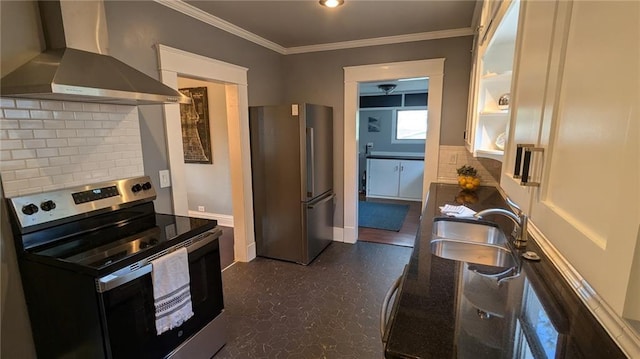 kitchen featuring a sink, appliances with stainless steel finishes, crown molding, wall chimney range hood, and tasteful backsplash