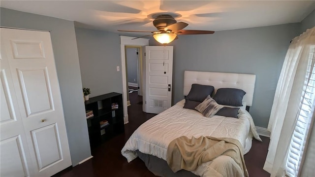 bedroom with baseboards and ceiling fan