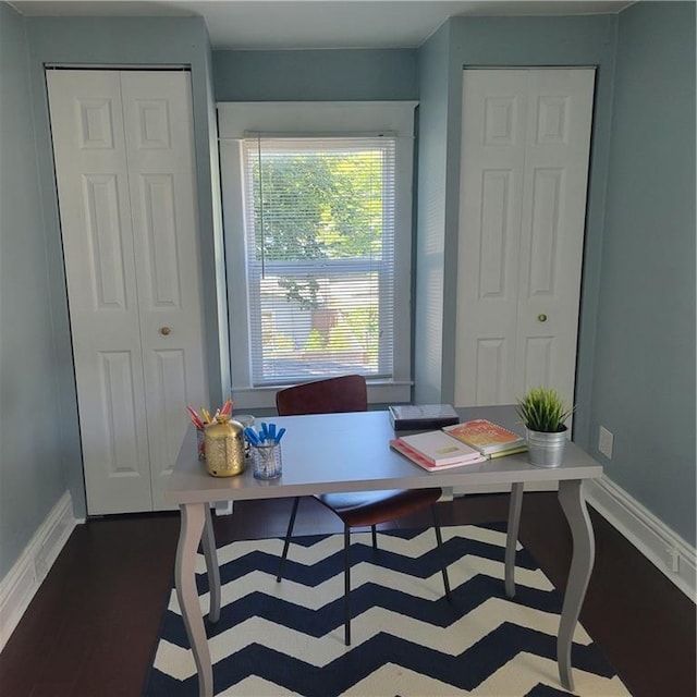 office space featuring wood finished floors and baseboards