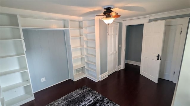 unfurnished bedroom featuring visible vents, baseboards, a closet, a ceiling fan, and dark wood-style flooring