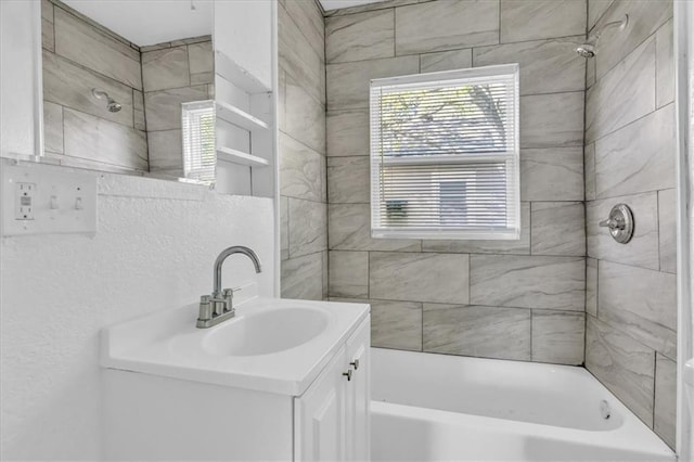 full bath featuring vanity and bathtub / shower combination