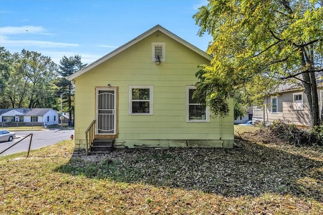 back of house featuring entry steps