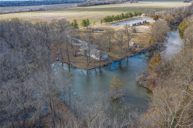 birds eye view of property featuring a water view and a rural view