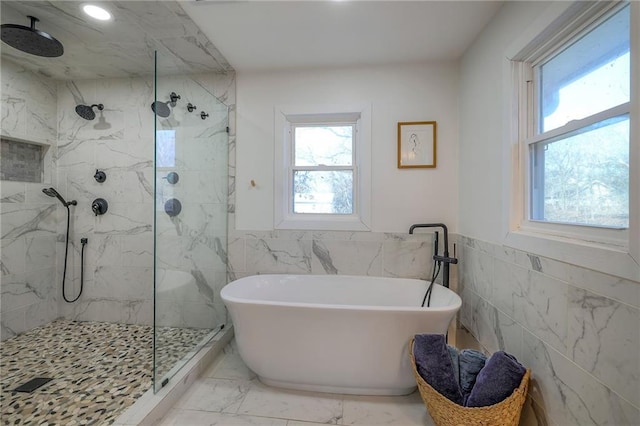 350 NW 71p Rd, Clinton, MO 64735 - full bathroom with plenty of natural light, a marble finish shower, a soaking tub, and tile walls