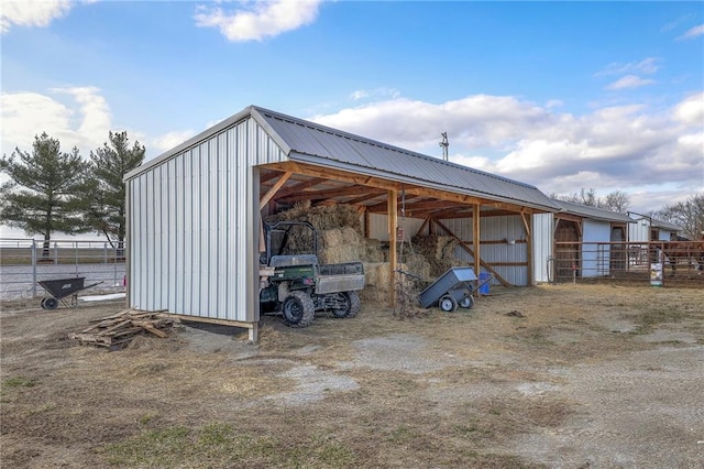 350 NW 71p Rd, Clinton, MO 64735 - view of parking / parking lot with fence and an outbuilding