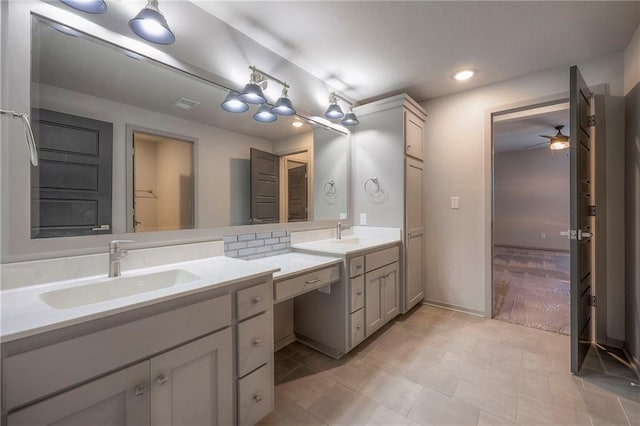 bathroom with recessed lighting, vanity, and ceiling fan