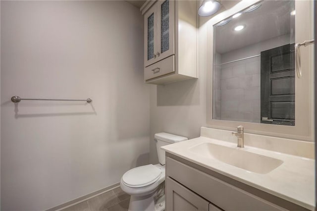 full bath with tile patterned floors, toilet, and vanity