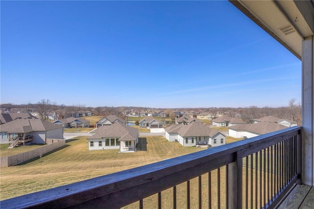 balcony with visible vents and a residential view