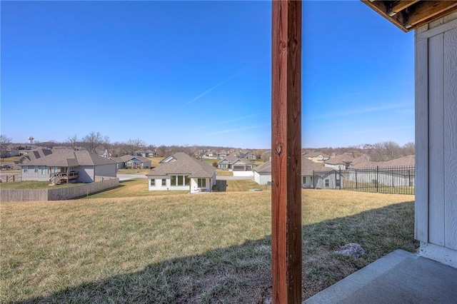 view of yard featuring a residential view and fence