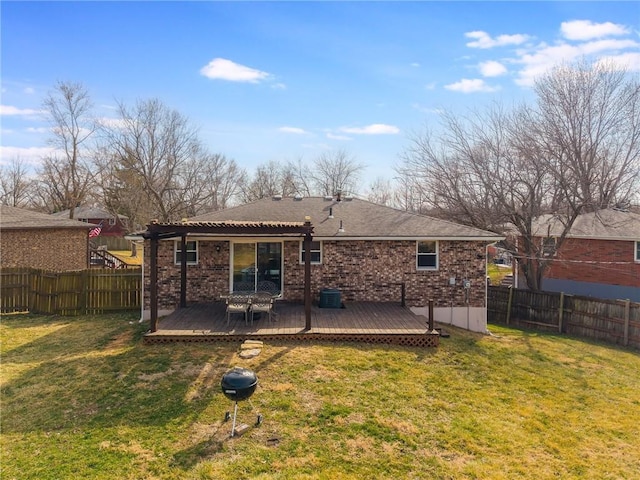 rear view of property featuring a yard, cooling unit, brick siding, and fence private yard