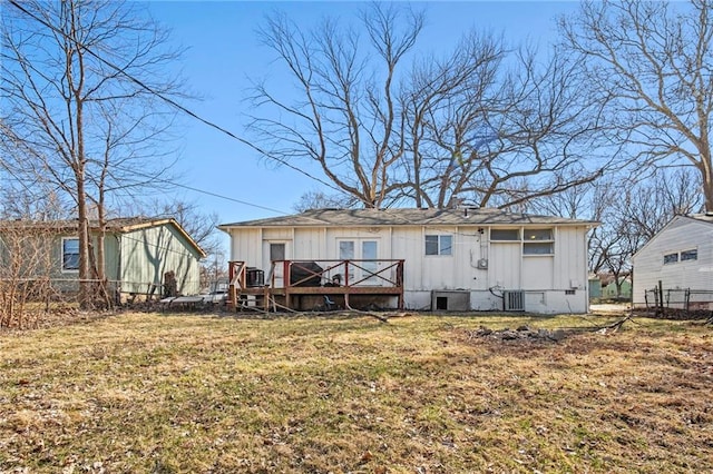 rear view of house with fence, central air condition unit, a wooden deck, a yard, and crawl space