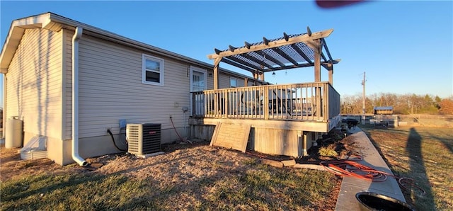 view of side of property featuring cooling unit, a wooden deck, and a pergola