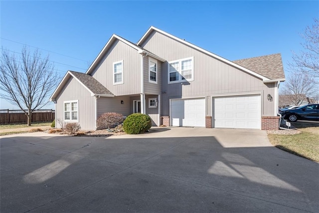 view of front of house featuring fence, roof with shingles, concrete driveway, a garage, and brick siding