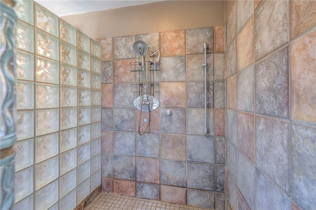 full bath featuring tiled shower