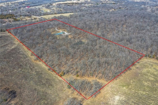 birds eye view of property with a rural view