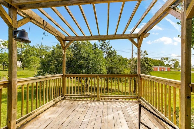 wooden deck featuring a yard