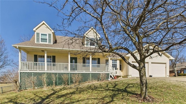 cape cod-style house with covered porch, a shingled roof, concrete driveway, a front lawn, and a garage