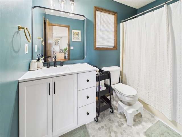 bathroom with toilet and vanity