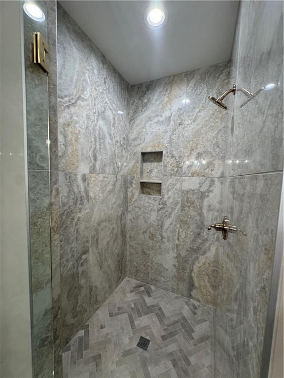 bathroom with a shower stall