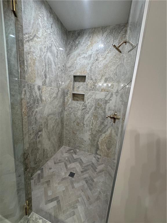 full bathroom with a shower stall