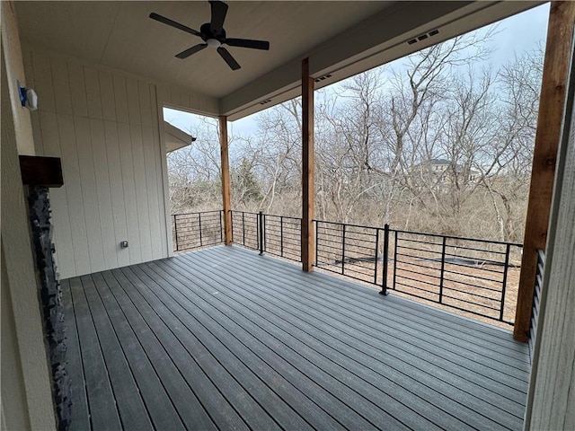 wooden deck featuring a ceiling fan