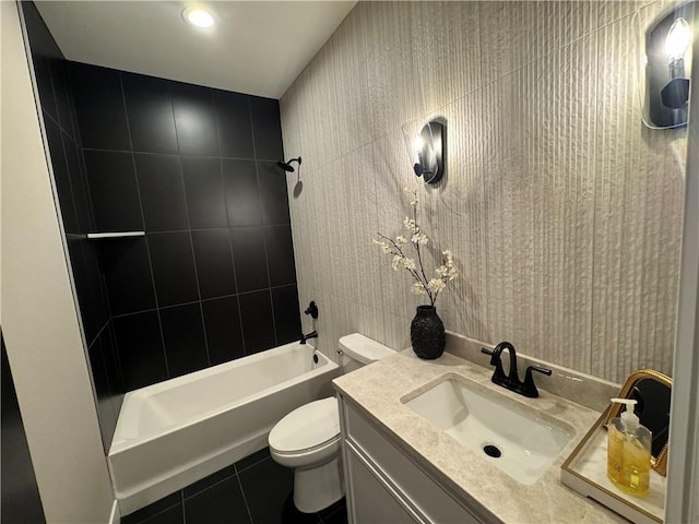 bathroom featuring tile patterned flooring, shower / bathing tub combination, toilet, and vanity