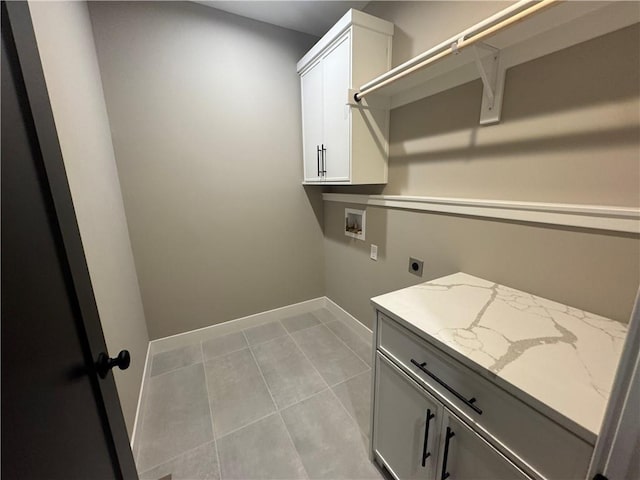 laundry room with baseboards, light tile patterned floors, hookup for a washing machine, cabinet space, and electric dryer hookup