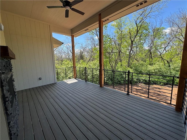 wooden terrace featuring ceiling fan