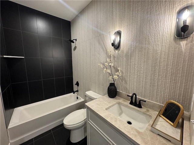 full bathroom featuring vanity, tile patterned floors, bathing tub / shower combination, and toilet