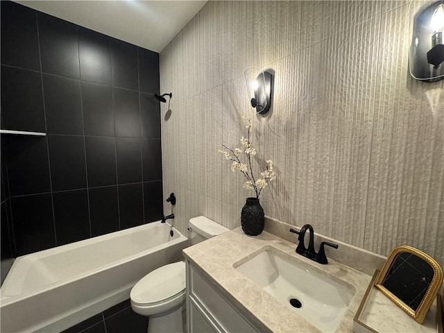 bathroom with shower / tub combination, tile patterned flooring, toilet, and vanity