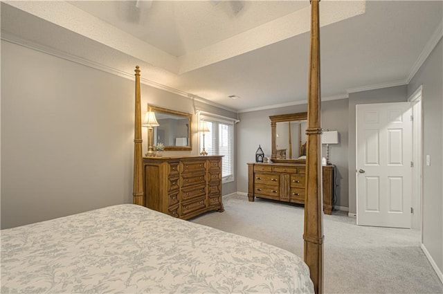 bedroom with baseboards, light carpet, and crown molding