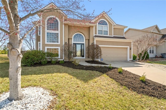 traditional-style home with stucco siding, an attached garage, concrete driveway, and a front lawn