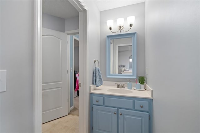 bathroom featuring vanity and an inviting chandelier