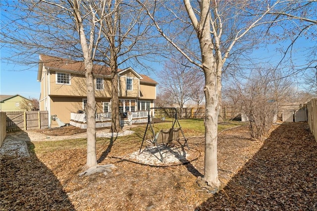 view of yard with a deck and a fenced backyard