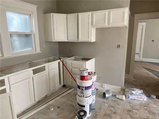 kitchen featuring white cabinets