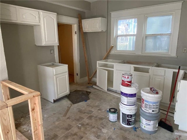 kitchen featuring white cabinetry