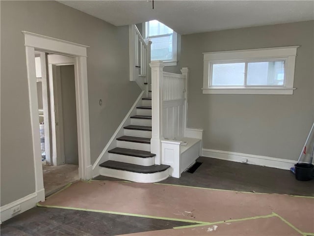 stairs with baseboards