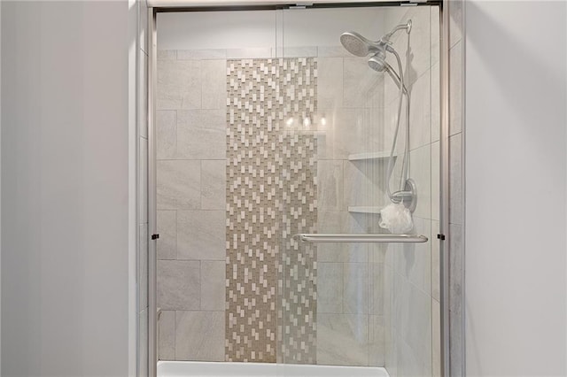 bathroom with a shower stall
