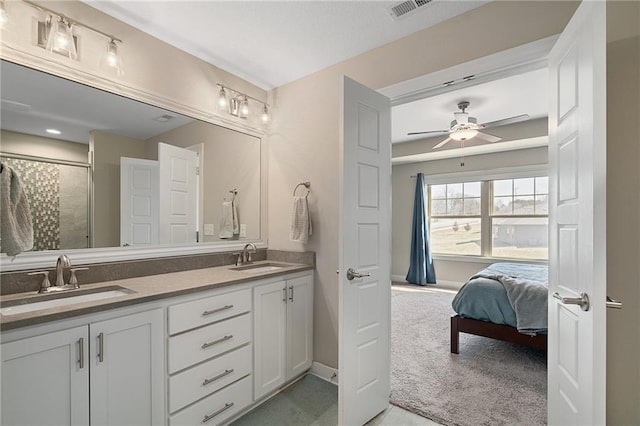 full bath featuring a sink, visible vents, ceiling fan, and double vanity
