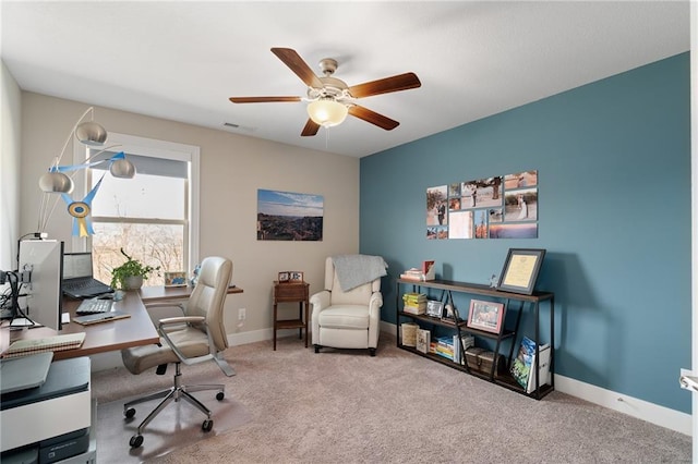 office area featuring carpet flooring, baseboards, and ceiling fan